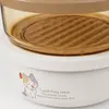 Mini 300ml round food storage container measuring 11.5 by 11.5 by 5.6cm with beige PP lid and removable inner tray