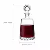 Red wine decanter with elegant round glass stopper and clear bottle design