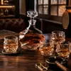 Unique whiskey decanter gift set with four matching textured drinking glasses