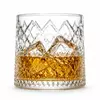Diamond cut mountain whiskey glass with textured geometric pattern and landscape design