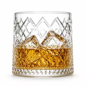 Diamond cut mountain whiskey glass with textured geometric pattern and landscape design