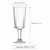 Vertical ribbed beverage glass with stem and stable circular foot