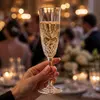 Decorative sparkling wine flute with geometric lower bowl pattern
