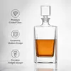 Clear tall whiskey decanter designed for modern home bar spirits presentation