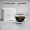 Compact transparent espresso mug with curved side handle and 70mm overall height
