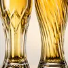 tall embossed beer glass with decorative raised pattern