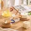 Cute printed glass mug with colorful handle for coffee milk and tea