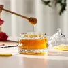 Stylish decorative glass honey container with crystal-clear beehive texture and elegant lid