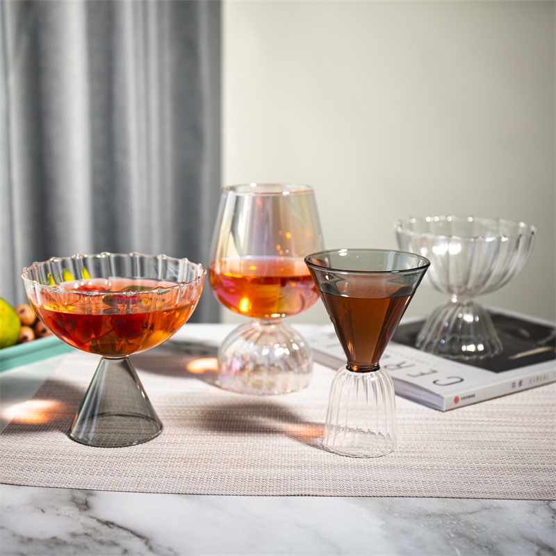 Unique cocktail glass from Jiateng with ribbed base and sleek upper portion, suitable for parties, cocktails, or special events