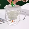 Jiateng festive glass tumbler with Santa topper, double-wall insulation for winter drinks.