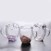 Jiateng handmade glass tea cups with embedded flowers, designed to prevent condensation while adding elegance to your drink.