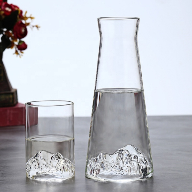 Clear glass pitcher and matching tumbler with mountain-shaped base, perfect for water, juice, or cocktails, stylish home tableware