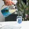 Elegant transparent glass pitcher and cup set for juice and water serving