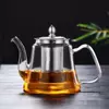 Stylish glass teapot set with infuser and matching tea cups for elegant serving
