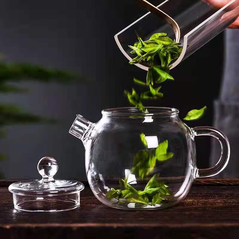 Jiateng clear glass teapot with two double-wall cups, elegant design for brewing and serving tea, ideal for home or café use