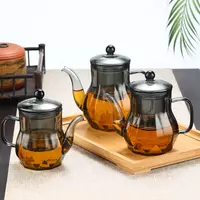 Elegant smoked glass teapot with built-in infuser for loose leaf tea brewing