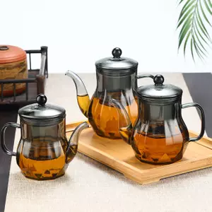 Elegant smoked glass teapot with built-in infuser for loose leaf tea brewing