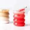 Aesthetic ripple glass cup styled as a unique whiskey tumbler for elegant home bar decor