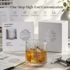 Custom whiskey tumbler with decorative mountain base for private label glassware buyers