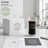 Transparent hourglass shaped double wall coffee mug filled with dark coffee and a golden crema layer
