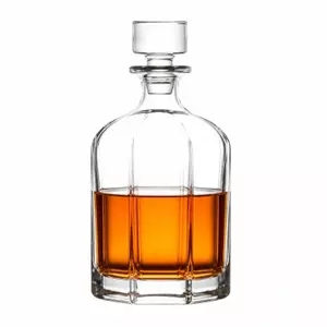 Vertical ribbed whiskey decanter with rounded shoulders and clear glass stopper