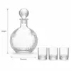 Patterned glass whiskey decanter with matching short whiskey tumblers