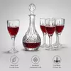 Patterned glass wine decanter and matching glasses for elegant wine presentation