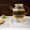 Elegant clear glass teapot with removable stainless steel infuser and wooden lid