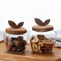 Jiateng decorative glass snack storage jar with handcrafted wooden leaf lid