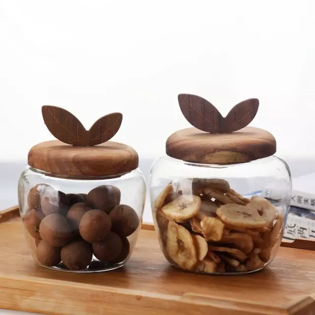 Jiateng decorative glass snack storage jar with handcrafted wooden leaf lid