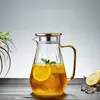 Transparent glass juice pitcher featuring crystal-inspired geometric styling