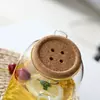 Elegant glass beverage pitcher with wooden lid for water, juice, and fruit-infused drinks