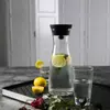 Clear glass water jug with sleek minimalist design for modern dining tables