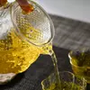 Heat resistant textured glass tea pot with matching cups