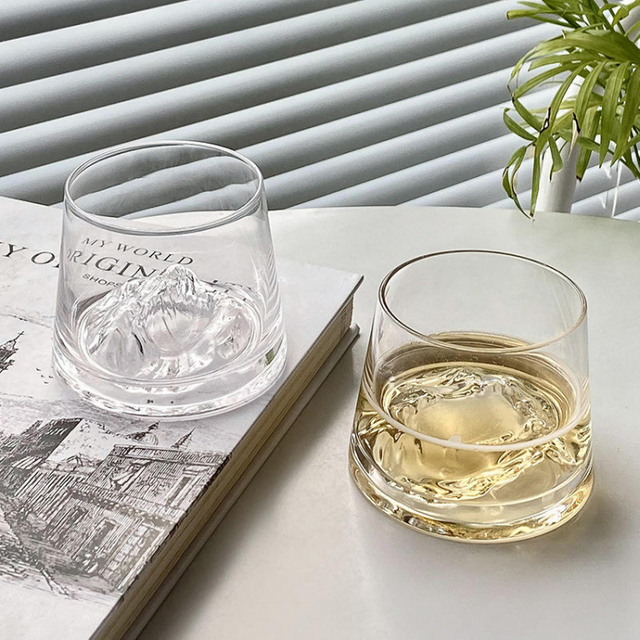 Jiateng whiskey and beer glass with 3D mountain-shaped base, perfect for serving spirits or beer, stylish and modern for home or bar