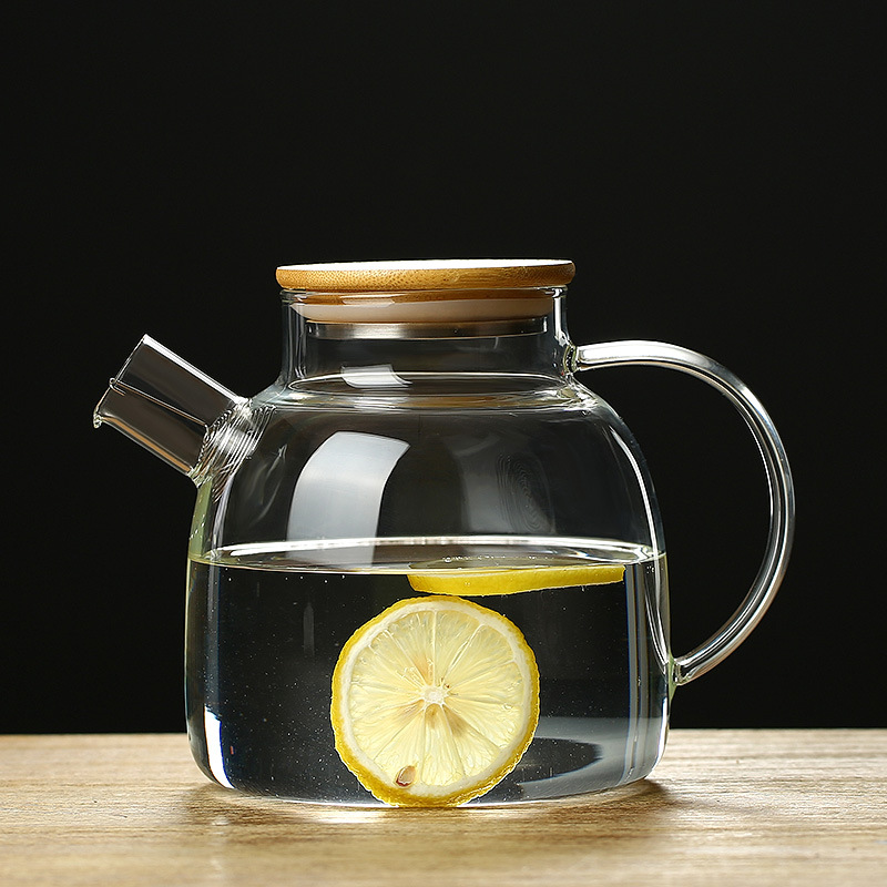 Jiateng glass pitcher with bamboo lid, perfect for brewing tea or serving cold beverages, practical and stylish for any setting