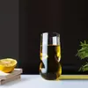 Irregular organic glass cup with unique sculptural curves for aesthetic home decor