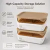 Rectangular kitchen food storage box featuring a removable raised drain tray for separating suitable food contents from the container bottom.