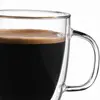 Transparent double wall coffee mug with rounded inner chamber and curved outer glass walls