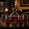 red wine serving set with one decorative decanter and four stemless drinking glasses