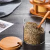 Stylish glass kitchen storage jars with bamboo tray for convenient seasoning organization