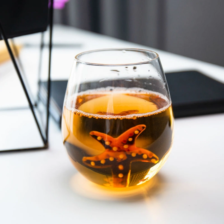 Close-up of 3D starfish design at the base of glass cup