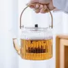 Transparent borosilicate glass tea kettle designed for herbal tea brewing