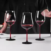 Jiateng modern red stem wine glasses set with black base, showcasing elegant and contemporary crystal stemware for dinner party