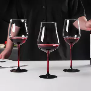 Jiateng modern red stem wine glasses set with black base, showcasing elegant and contemporary crystal stemware for dinner party