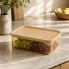 Technical dimensions of 1270ml and 1800ml horizontal glass food storage containers showing top and side views