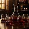 clear red wine decanter with four rounded stemless glasses for tabletop wine serving