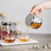 Heat-resistant glass teapot featuring a durable stainless steel lid and crystal-clear body