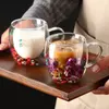 Jiateng premium glass cups with floral design, providing heat insulation and a stunning visual effect for coffee or tea lovers.