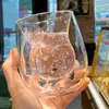 double layer glass cup with cartoon cat design and creamy milk inside